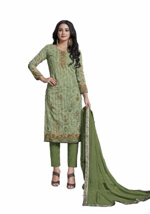 Grab This Very Beautiful Designer Straight Suit In Light Green Colored Top Paired With Green Colored Bottom And Dupatta. Its Heavy Embroidered Top Is Fabricated On Cotton Paired With Viscose Bottom And Chiffon Fabricated Dupatta. Buy This Semi-Stitched Suit Now.