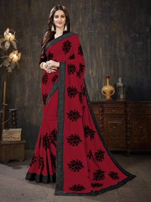 Here Is A Very Pretty Designer Silk Based Saree In Red Color Paired With Black Colored Blouse. It Is Beautified With Black Colored Thread Work Motifs All Over. Also It Is Light In Weight And Easy To Carry Throughout The Gala. Buy Now.
