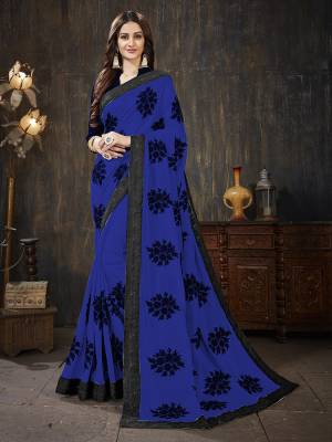 Here Is A Very Pretty Designer Silk Based Saree In Royal Blue Color Paired With Black Colored Blouse. It Is Beautified With Black Colored Thread Work Motifs All Over. Also It Is Light In Weight And Easy To Carry Throughout The Gala. Buy Now.