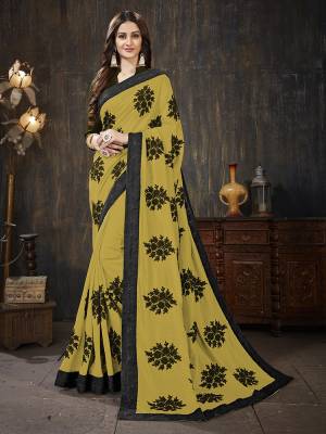 Here Is A Very Pretty Designer Silk Based Saree In Musturd Yellow  Color Paired With Black Colored Blouse. It Is Beautified With Black Colored Thread Work Motifs All Over. Also It Is Light In Weight And Easy To Carry Throughout The Gala. Buy Now.