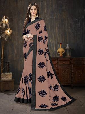Here Is A Very Pretty Designer Silk Based Saree In Dusty Pink Color Paired With Black Colored Blouse. It Is Beautified With Black Colored Thread Work Motifs All Over. Also It Is Light In Weight And Easy To Carry Throughout The Gala. Buy Now.