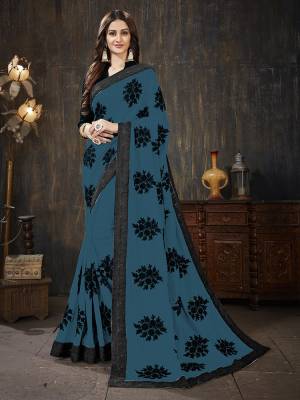 Here Is A Very Pretty Designer Silk Based Saree In Blue Color Paired With Black Colored Blouse. It Is Beautified With Black Colored Thread Work Motifs All Over. Also It Is Light In Weight And Easy To Carry Throughout The Gala. Buy Now.
