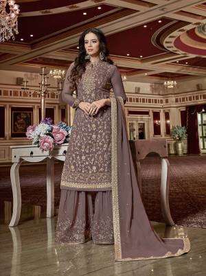 New And Unqiue Shade Of Purple And Grey Is Here With This Heavy Designer Sharara Suit In Mauve Color. Its Embroidered Top And Bottom Are Fabricated On Georgette Paired With Chiffon Fabricated Dupatta. It Is Light In Weight And Easy To Carry All Day Long. 