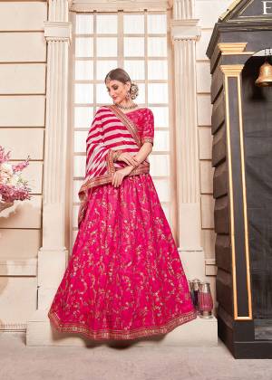 Shine Bright Wearing This Heavy Designer Lehenga Choli In Dark Pink Color Paired With Dark Pink And White Colored Dupatta. Its Blouse And Lehenga Are Fabricated On Art Silk Paired With Georgette Fabricated Dupatta. Its Fabrics Are Light Weight And Ensures Superb Comfort All Day Long. 