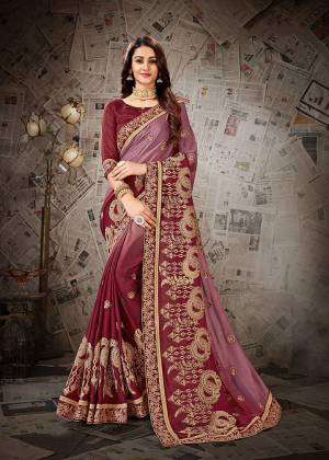 Here Is A Very Pretty Shaded Designer Saree To Add Into Your Wardrobe In Maroon And Pink Color Paired With Maroon Colored Blouse. This Heavy Embroidered Saree Is Fabricated on Chiffon Paired With art Silk Fabricated Blouse. Buy Now.