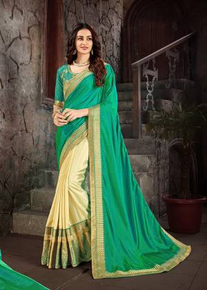 Grab This Very Beautiful Rich and Elegant Looking Heavy Designer Saree In Sea Green And Cream Color Paired With Sea Green Colored Blouse .This Saree Is Fabricated On Art Silk Paired With Cotton Slub Fabricated Blouse. 