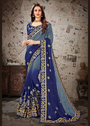 Simple And Elegant Looking Designer Saree Is Here In Grey And Royal Blue Color paired With Royal Blue Colored Blouse .This Saree Is Fabricated On Chiffon Paired With Art Silk Fabricated Blouse. Its Elegant Embroidery And Subtle Color Pallete Will Earn You Lots Of Compliments From Onlookers.