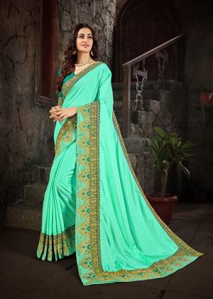 Bright And Visually Appealing Shades Are Here With This Designer Saree In Aqua Green Color Paired With Teal Green Colored Blouse. This Saree IS Fabricated on Art Silk Paired With Cotton Slub Fabricated Blouse. This Saree Is Light Weight And Easy To Carry All Day Long. 