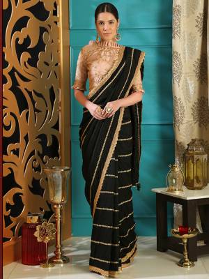 For A Bold And Beautiful Look, Grab This Designer Silk Based Saree In Black Color Paired With Nude Pink Colored Embroidered Blouse. Its Elegant Silk Fabric Will Give A Rich Look To Your Personality. Buy Now.