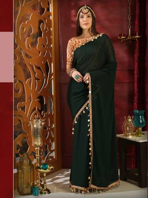 New And Unique Color Pallete Is Here With This Designer Saree In Pine Green Color Paired With Contrasting Peach Colored Blouse. This Saree Is Fabricated On Georgette Paired With Heavy Embroidered Art Silk Fabricated Blouse. It Is Light In Weight And easy To Carry Throughout The Gala.
