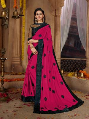 Here Is A Very Pretty Designer Based Saree In Rani Pink Color Paired With Black Colored Blouse. This Pretty Saree Is Fabricated on Satin Georgette Paired With Art Silk And Net Fabricated Blouse. It Is Beautified With Black Colored Thread Work Motifs All Over. Also It Is Light In Weight And Easy To Carry Throughout The Gala. Buy Now