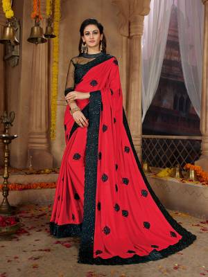 Here Is A Very Pretty Designer Based Saree In Red Color Paired With Black Colored Blouse. This Pretty Saree Is Fabricated on Satin Georgette Paired With Art Silk And Net Fabricated Blouse. It Is Beautified With Black Colored Thread Work Motifs All Over. Also It Is Light In Weight And Easy To Carry Throughout The Gala. Buy Now