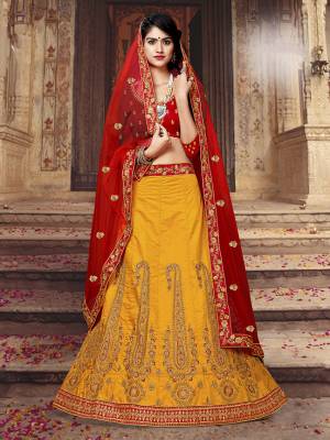 Grab This Beautiful And Heavy Designer Lehenga Choli For The Upcoming Festive And Wedding Season In Red Colored Blouse Paired With Contrasting Musturd Yellow Colored Lehenga And Red Colored Dupatta. Its Blouse And Lehenga are Silk Based Paired With Net Fabricated Dupatta. Buy Now.