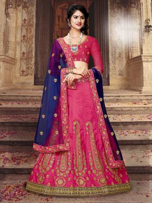 Bright And Appealing Color Pallete Is Here With This Designer Lehenga Choli In Dark Pink Color Paired With Contrasting Royal Blue Colored Dupatta. Its Blouse And Lehenga Are Fabricated On Art Silk Paired With Net fabricated Dupatta. Buy Now.