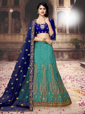 Go With Shades Of Blue With This Designer Lehenga Choli In Royal Blue Colored Blouse Paired With Blue Colored Lehenga And Royal Blue Colored Dupatta. Its Blouse And Lehenga are Silk Based Paired With Net Fabricated Dupatta. Buy Now.