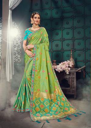 Celebrate This Festive Season Wearing This Heavy Designer Saree In Green Color Paired With Contrasting Blue colored Blouse. This Heavy Embroidered Saree Is Fabricated On Jacquard Silk Paired With Cotton Slub Fabricated Embroidered Blouse. Its Rich Fabric And Pretty Color Pallete Will Earn You Lots Of Compliments From Onlookers. Buy Now.