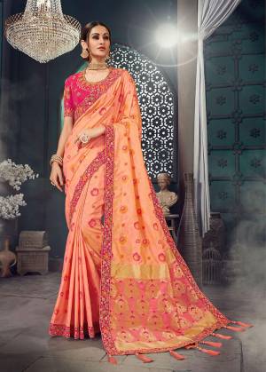 A Must Have Shade In Every Womens Wardrobe Is Here With This Designer Saree In Dark Peach Color Paired With Contrasting Rani Pink Colored Blouse .This Rich Jacquard Silk Fabricated Saree Is Paired With Cotton Slub Fabricated Blouse. Buy This Lovely Piece Now.