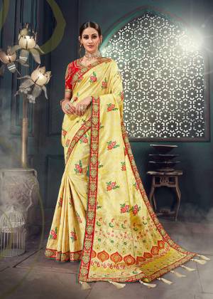 Celebrate This Festive Season Wearing This Heavy Designer Saree In Light Yellow Color Paired With Contrasting Red colored Blouse. This Heavy Embroidered Saree Is Fabricated On Jacquard Silk Paired With Cotton Slub Fabricated Embroidered Blouse. Its Rich Fabric And Pretty Color Pallete Will Earn You Lots Of Compliments From Onlookers. Buy Now.