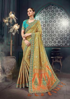 A Must Have Shade In Every Womens Wardrobe Is Here With This Designer Saree In Multi Color Paired With Contrasting Blue Colored Blouse .This Rich Jacquard Silk Fabricated Saree Is Paired With Cotton Slub Fabricated Blouse. Buy This Lovely Piece Now.