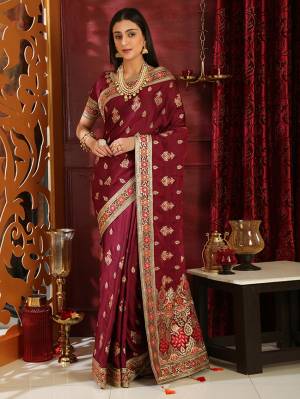 Enhance Your Personality In This Heavy Embroiderd Designer Saree In Maroon Color. This Saree And Blouse Are Fabricated on Soft Silk Which IS Light Weight And Durable. Buy Now.