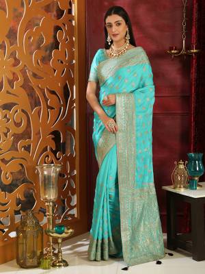Get Ready For The Upcoming Wedding Season With This Heavy Designer Saree In Turquoise Blue Color. This Saree And Blouse Are Fabricated On Soft Silk Beautified With Jari Embroidery And Stone Work. Its Pretty Jari Work Gives A Rich And Subtle Look To Your Personality. 