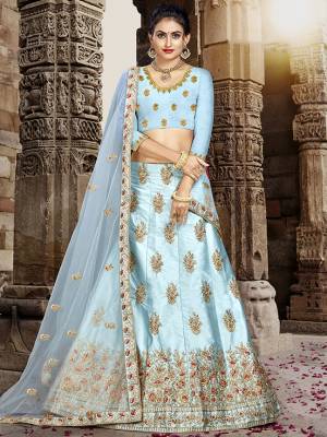 Grab This Very Beautiful And Elegant Looking Designer Lehenga Choli In All Over Sky Blue Color. Its Blouse Is Fabricated On Art Silk Paired With Satin Silk Fabricated Lehenga And Net Fabricated Dupatta. It Is Beautified With Jari And Resham Embroidery With Stone Work. Buy Now.