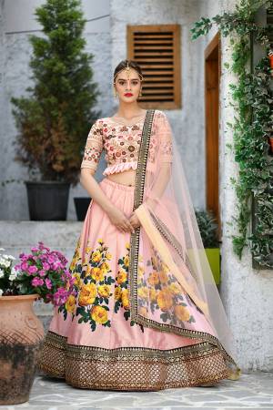 Look Pretty In This Very Beautiful Designer Lehenga Choli In All Over Peach Color. Its Heavy Embroidered Blouse Is Fabricated On Velvet Paired With Digital Printed Art Silk Fabricated Lehenga And Net Fabricated Dupatta. Buy Now.