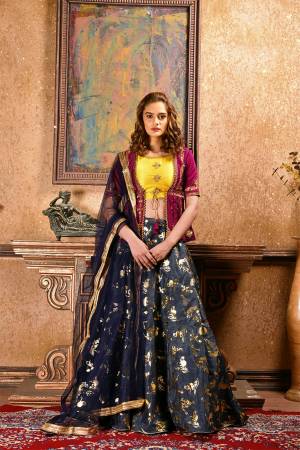 For An Indo-Western Look, Grab This Unique Patterned Designer Lehenga Choli In Magenta Pink And Yellow Colored Blouse Paired With Navy Blue Colored Lehenga And Dupatta. Its Blouse Is Fabricated On Satin Silk Paired With Foil Printed Art Silk Lehenga And Net Fabricated Dupatta. 