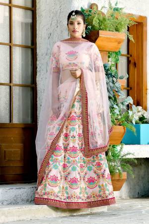 A Perfect Outfit For The Upcoming Wedding Season Is Here With This Heavy Designer Lehenga Choli In All Over Baby Pink Color. Its Blouse And Lehenga Are Fabricated On Art Silk Paired With Net Fabricated Dupatta. Buy This Now.