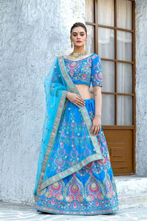 Look Pretty In This Very Beautiful Designer Lehenga Choli In All Over Blue Color. Its Heavy Embroidered Blouse And Lehenga Are Fabricated On Velvet Paired With Net Fabricated Dupatta. Buy Now.