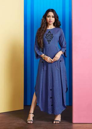 Grab This Readymade Pretty Kurti In Dark Blue Color Fabricated On Rayon Slub. This Pretty Kurti Is Patch Over The Front And Buttons. 