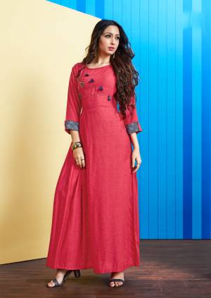 Simple And Elegant Readymade Long Kurti Is Here In Dark Pink Color. This Kurti Is Fabricated On Rayon Slub Beautified With Buttons And Tassels. It Is Light In Weight and Easy To Carry All Day Long. 