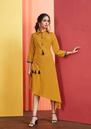 Asymmetric Patterned Readymade Kurti Is Here In Musturd Yellow Color Fabricated On Rayon Slub. Its Fabric Is Soft Towards Skin And Ensures Superb Comfort All Day Long. 