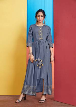 For Your Semi-Casual Wear, Grab This Designer Readymade Kurti In Blue Color With A Unique Pattern. This Kurti Is Fabricated On Rayon Slub Which Is Light Weight, Durable And Easy To Care For. 