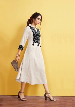 Simple And Elegant Readymade Long Kurti Is Here In Off-White Color. This Kurti Is Fabricated On Rayon Slub Beautified With Printed Pattern And Tassels. It Is Light In Weight and Easy To Carry All Day Long. 