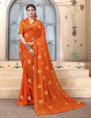 Celebratrate This Festive Season With Beauty And Comfort Wearing This Designer Saree In Orange Color Paired With Orange Colored Blouse. This Pretty Saree Is Fabricated on Georgette Paired With Art Silk Fabricated Blouse. It Is Beautified With Embroidered Motifs. 
