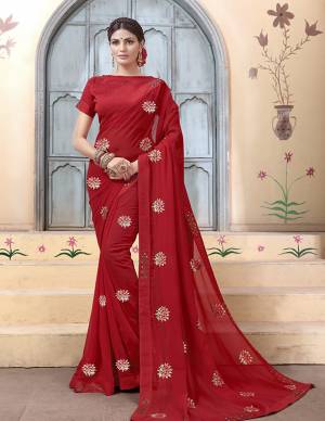Grab This Very Pretty Minimal Embroiderd Designer Saree In Maroon Color. This Pretty Saree IS Fabricated On Georgette Paired with Art Silk Fabricated Blouse. It Is Light In Weight And Easy To Carry All Day Long. 