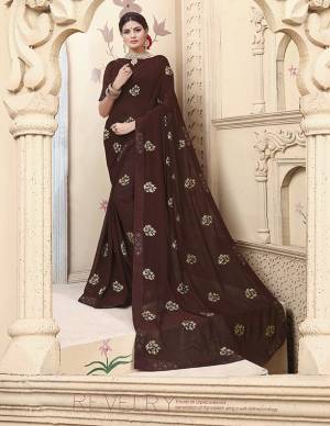 Celebratrate This Festive Season With Beauty And Comfort Wearing This Designer Saree In Brown Color Paired With Brown Colored Blouse. This Pretty Saree Is Fabricated on Georgette Paired With Art Silk Fabricated Blouse. It Is Beautified With Embroidered Motifs. 