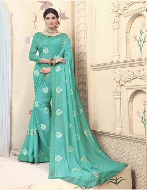 Celebratrate This Festive Season With Beauty And Comfort Wearing This Designer Saree In Sea Green Color Paired With Sea Green Colored Blouse. This Pretty Saree Is Fabricated on Georgette Paired With Art Silk Fabricated Blouse. It Is Beautified With Embroidered Motifs. 