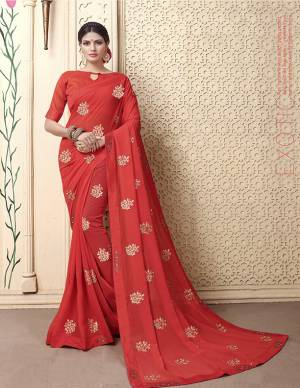 Grab This Very Pretty Minimal Embroiderd Designer Saree In Red Color. This Pretty Saree IS Fabricated On Georgette Paired with Art Silk Fabricated Blouse. It Is Light In Weight And Easy To Carry All Day Long. 