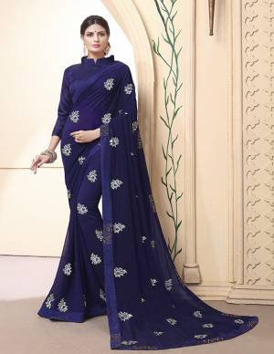 Celebratrate This Festive Season With Beauty And Comfort Wearing This Designer Saree In Navy Blue Color Paired With Navy Blue Colored Blouse. This Pretty Saree Is Fabricated on Georgette Paired With Art Silk Fabricated Blouse. It Is Beautified With Embroidered Motifs. 