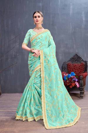 Get Ready For The Upcoming Festive And Wedding Season With This Heavy Designer Saree In Aqua Blue Color. This Pretty Saree Is Fabricated On Orgenza Paired With Art Silk Fabricated Blouse. It Is Beautified With Heavy Coding Embroidery With Sequence Work. Buy Now.