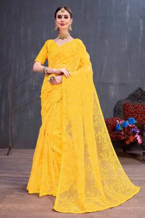 Catch All The Limelight At The Next Wedding You Attend Wearing This Heavy Designer Saree In Bright Yellow Color. This Saree Is Orgenza Based Paired With art Silk Fabricated Blouse .It Is Beautified With Tone To Tone Resham Embroidery Which Gives A Rich And Subtle Look Both At The Same Time. 