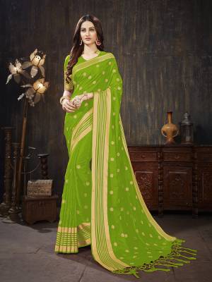 For A Rich And Elegant Look, Grab This Silk Based Designer Saree In Parrot Green Color. This Saree And Blouse are Fabricated On Art Silk Beautified With Weave And Jari Embroidered Butti. Buy This Saree Now.