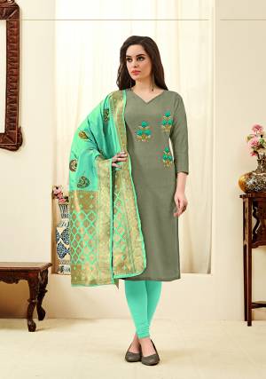 If Those Readymade Does Not Lend You The Desired Comfort, Than Grab This Dress Material In Grey And Sea Green Color And Get This Stitched As Per Your Desired Fit And Comfort. Its Top Is Fabricated On Cotton Slub Paired With Cotton Bottom And Banarasi Art Silk Dupatta. 