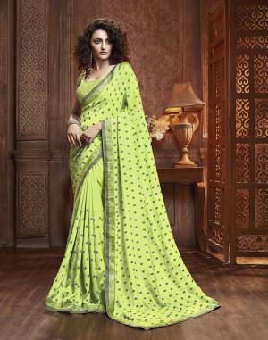 Celebrate This Festive Season With Beauty And Comfort Wearing This Designer Silk Based Saree In Light Green Color. This Saree Is Fabricated On Vichitra Silk Paired With Art Silk Fabricated Blouse. It Is Beautified With Itricate Embroidered Butti All Over. Buy This Lovely Saree Now.