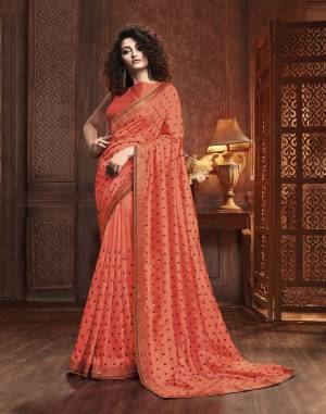 Celebrate This Festive Season With Beauty And Comfort Wearing This Designer Silk Based Saree In Orange Color. This Saree Is Fabricated On Vichitra Silk Paired With Art Silk Fabricated Blouse. It Is Beautified With Itricate Embroidered Butti All Over. Buy This Lovely Saree Now.