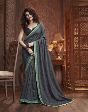 Celebrate This Festive Season With Beauty And Comfort Wearing This Designer Silk Based Saree In Dark Grey Color. This Saree Is Fabricated On Vichitra Silk Paired With Art Silk Fabricated Blouse. It Is Beautified With Itricate Embroidered Butti All Over. Buy This Lovely Saree Now.
