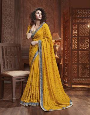 Celebrate This Festive Season With Beauty And Comfort Wearing This Designer Silk Based Saree In Musturd Yellow Color. This Saree Is Fabricated On Vichitra Silk Paired With Art Silk Fabricated Blouse. It Is Beautified With Itricate Embroidered Butti All Over. Buy This Lovely Saree Now.