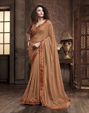 Celebrate This Festive Season With Beauty And Comfort Wearing This Designer Silk Based Saree In Beige Color. This Saree Is Fabricated On Vichitra Silk Paired With Art Silk Fabricated Blouse. It Is Beautified With Itricate Embroidered Butti All Over. Buy This Lovely Saree Now.